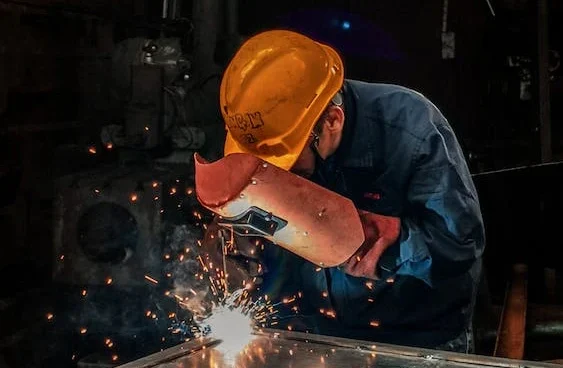Industrial worker using welding equipment