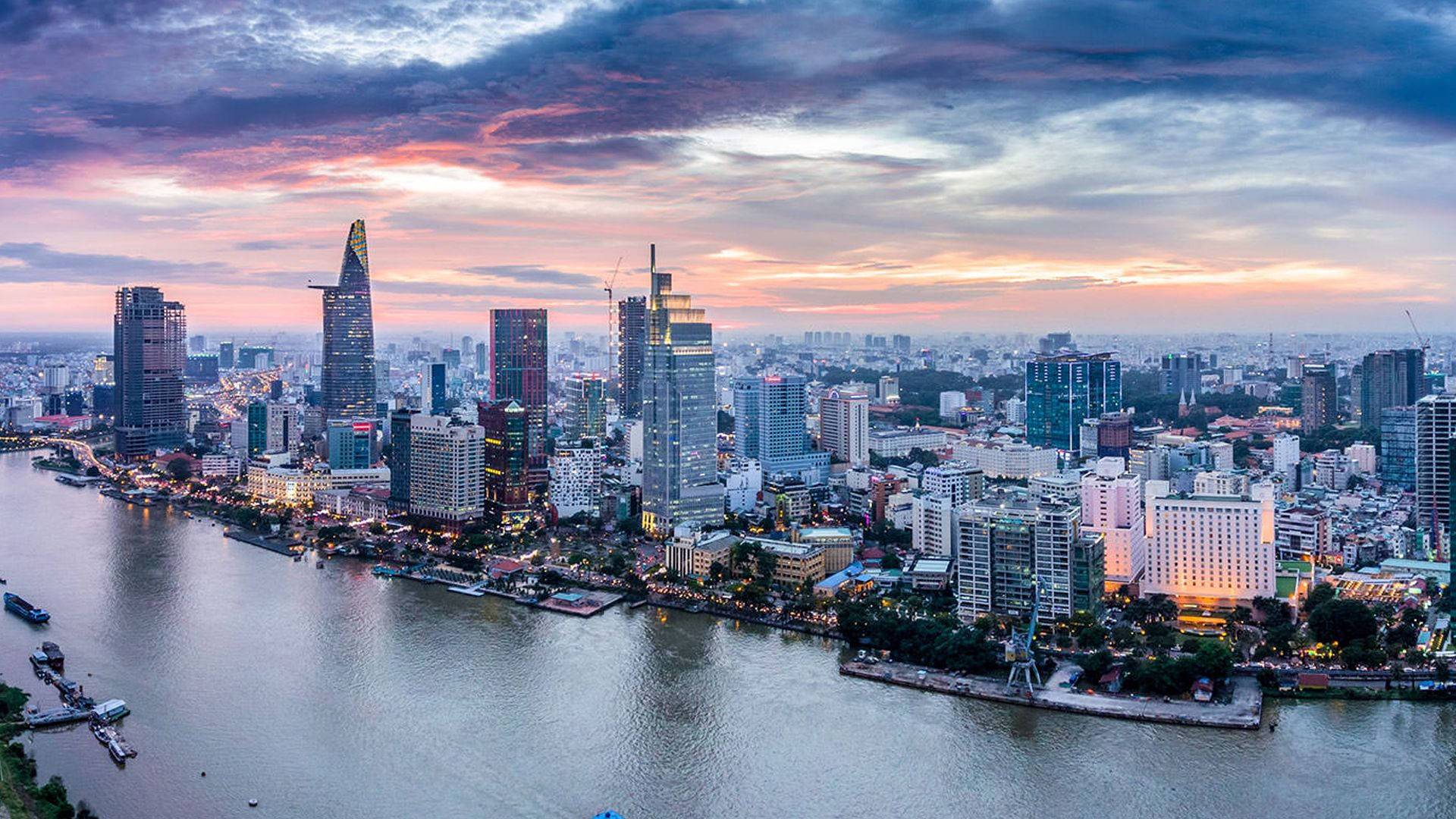 Wide urban skyline beneath a cloudy sky