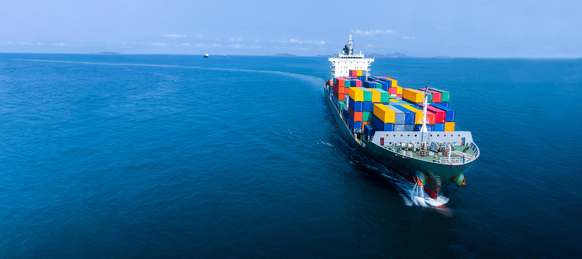 Cargo vessel travelling across open water