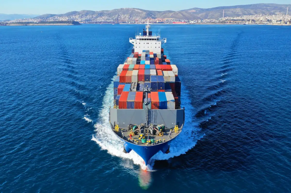 Container vessel crossing blue water
