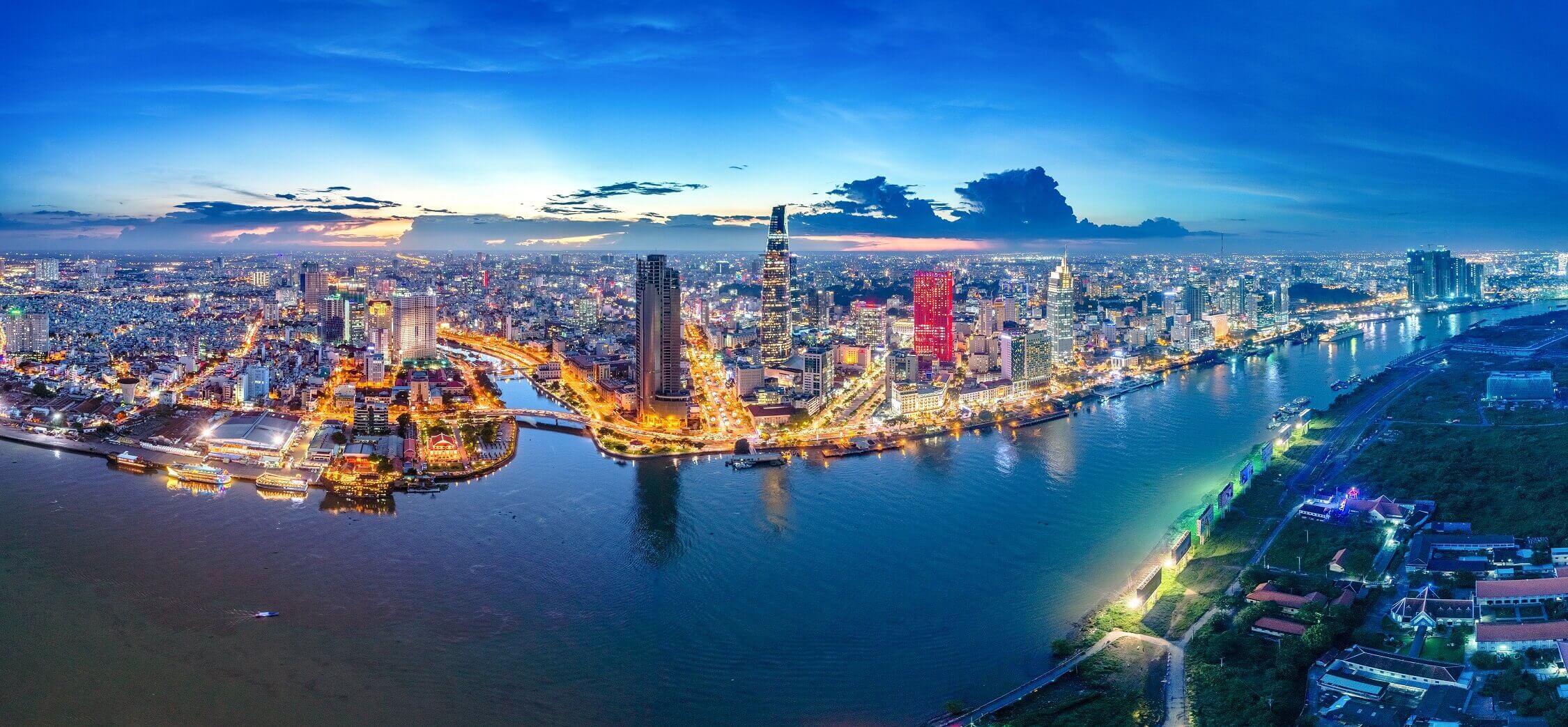 Illuminated city waterfront at night